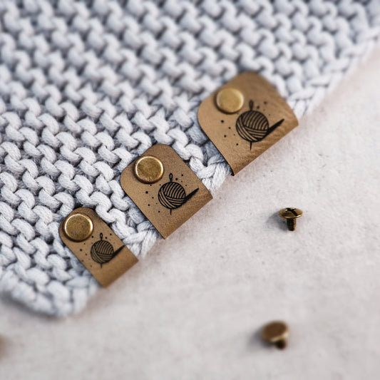 light beige faux leather tags vegan knit labels crochet no sew tag logo custom product tags rivet knit personalized tags vegan craft labels knit logo tags crochet faux leather labels hats mittens scarves coffee cup warmers clothing headbands blankets